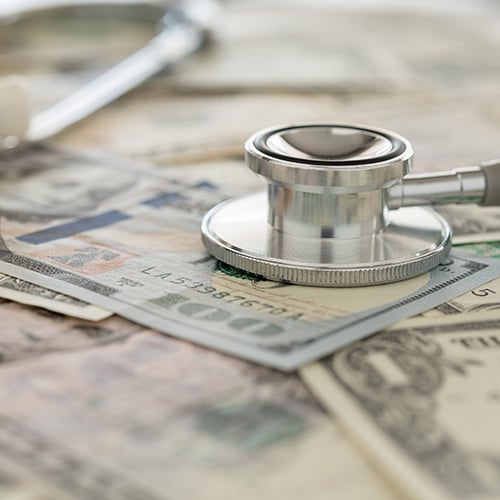 Stethoscope on money