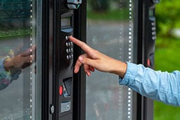 A person using a vending machine