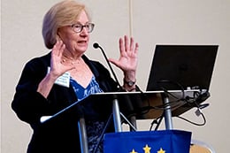 Linda Aiken speaking at a podium