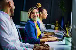 A group of people working at their computers